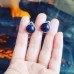 Blue Goldstone round ear clips