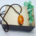 Red Agate oval pendant with a brown PU leather cord