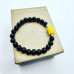 Black Obsidian Yellow Buddha charm Bracelet 8 mm