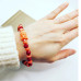 Orange Coral, Red Czech Glass Buddha charm bracelet